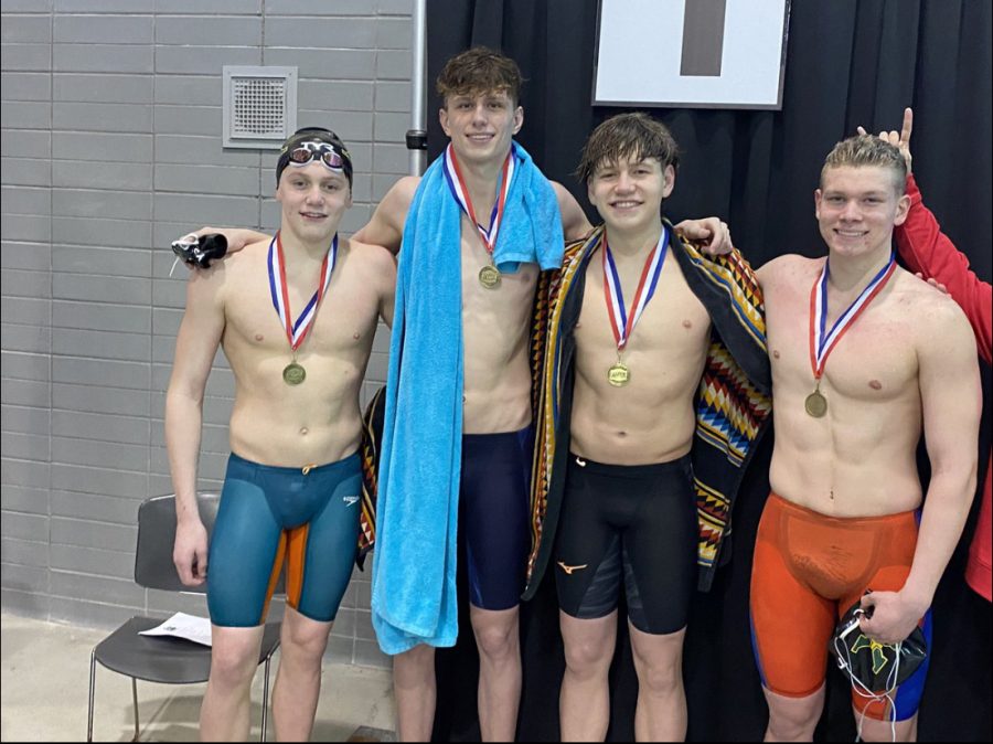 Charlie Crush, Will Scholtz, Lucas Thomas, and Johnny Crush celebrating their record breaking relay. 