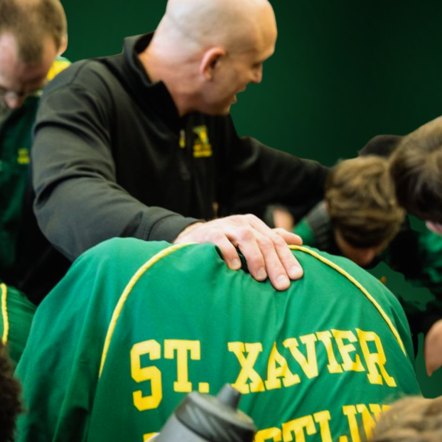 Coach K prays over his team 