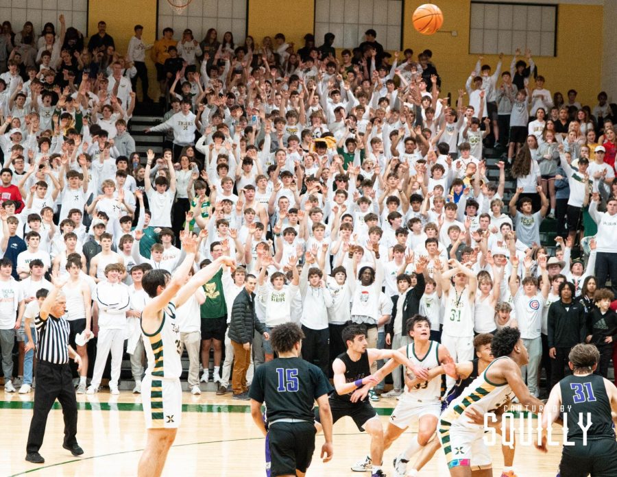 Sophomore Will Hanke shoots a free throw in front of the Rage Cage. 