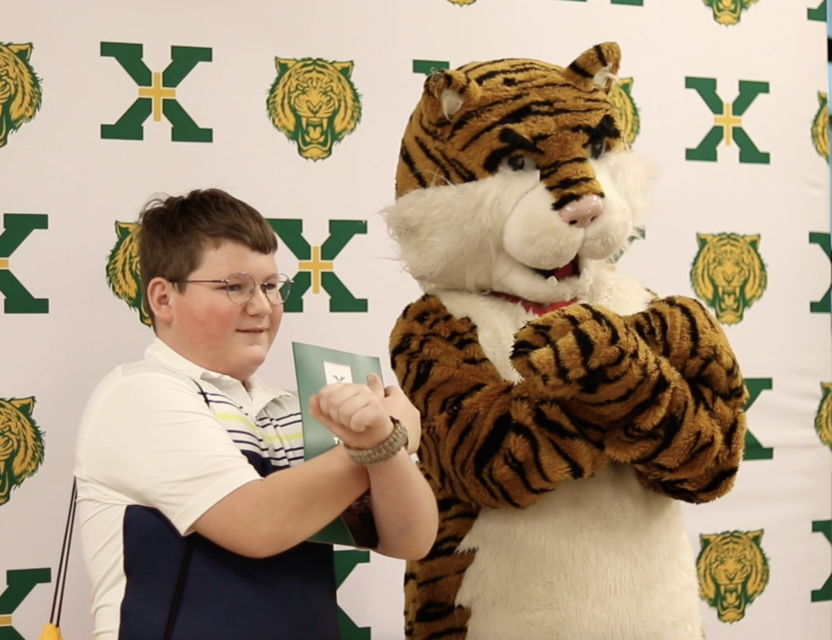 The Tiger poses with a prospective student during Open House (photo courtesy of Mr. Stemle)