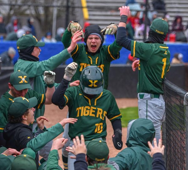 St. X dugout celebrates after scoring run (Photo used with permission of Jack Bates)