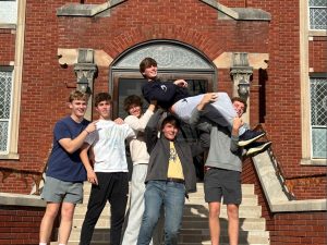 Student leaders hoist Liam Whelan in front of Mount St. Francis (photo courtesy of Cathy Reynolds)