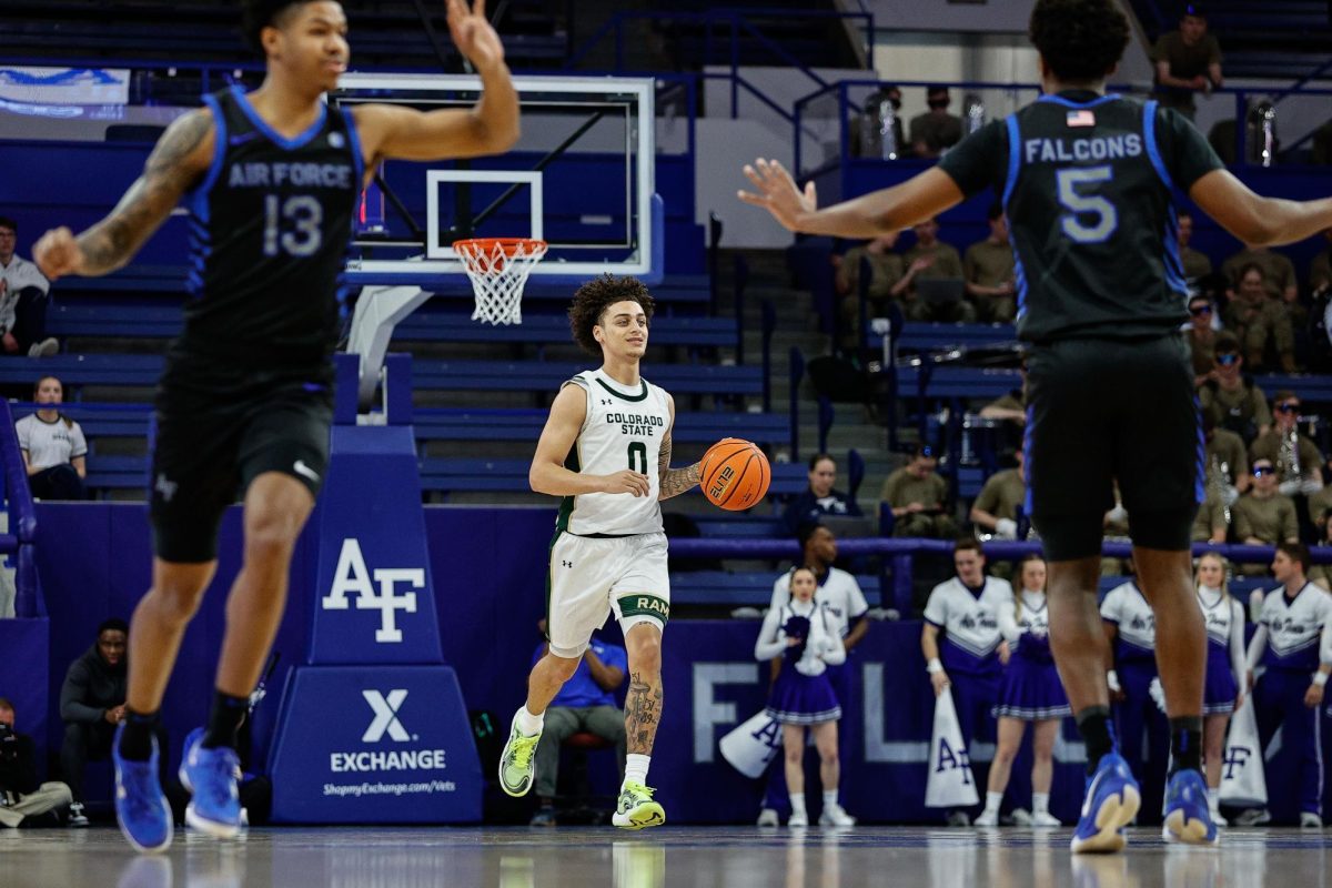 Feb 25, 2025; Colorado Springs, Colorado, USA; Colorado State Rams guard Kyan Evans (0) dribbles the ball up court as Air Force Falcons guard Chase Beasley (13) and guard Ethan Taylor (5) get postioned in the first half at Clune Arena. Mandatory Credit: Isaiah J. Downing-Imagn Images