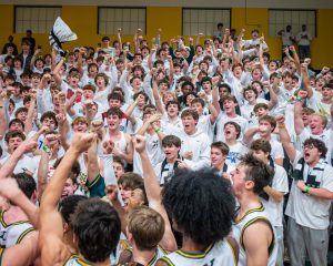 The team celebrating a win with the Rage Cage (photo courtesy of Jack Bates)