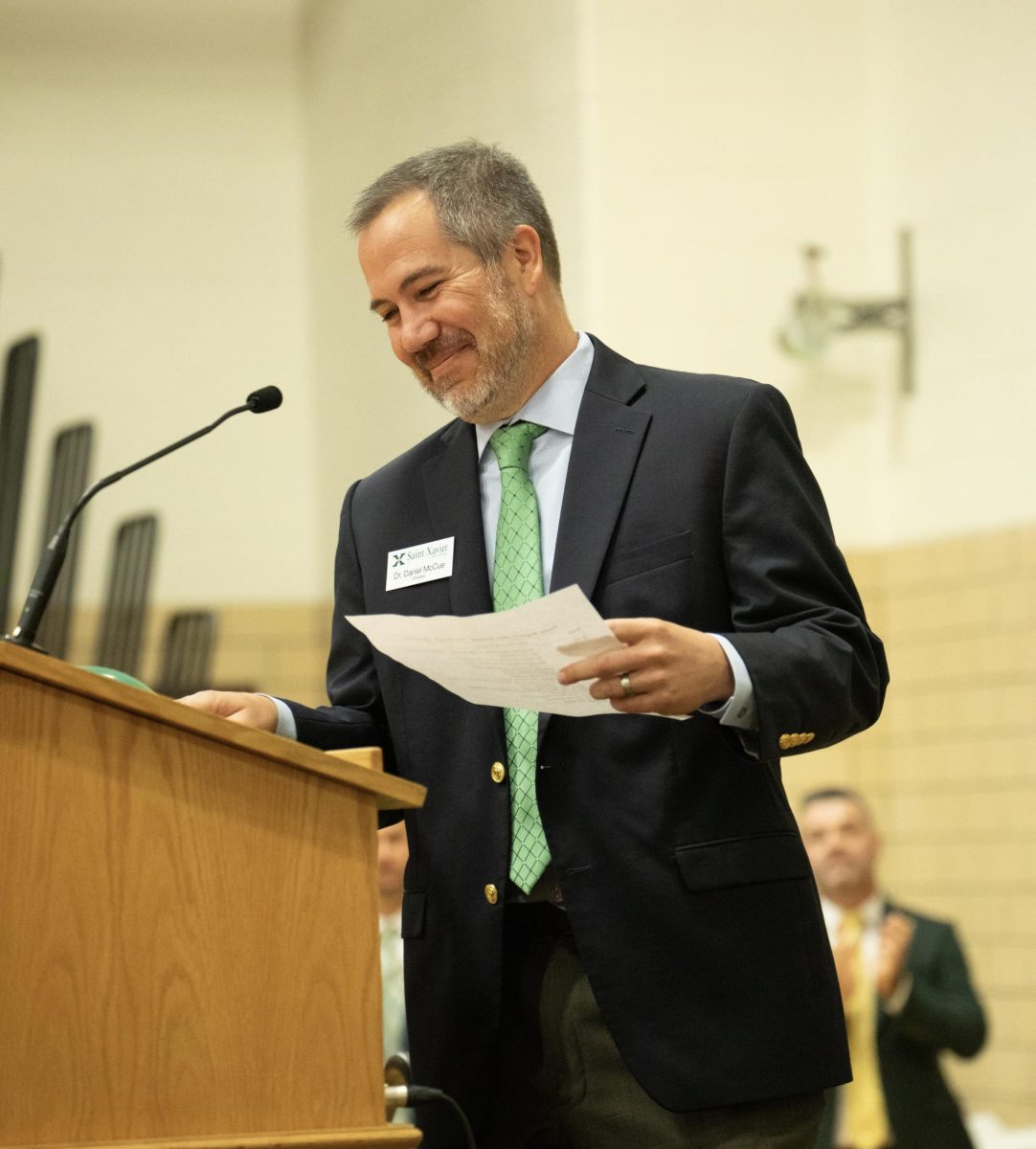 McCue preparing to deliver a speech during the first day's pep rally