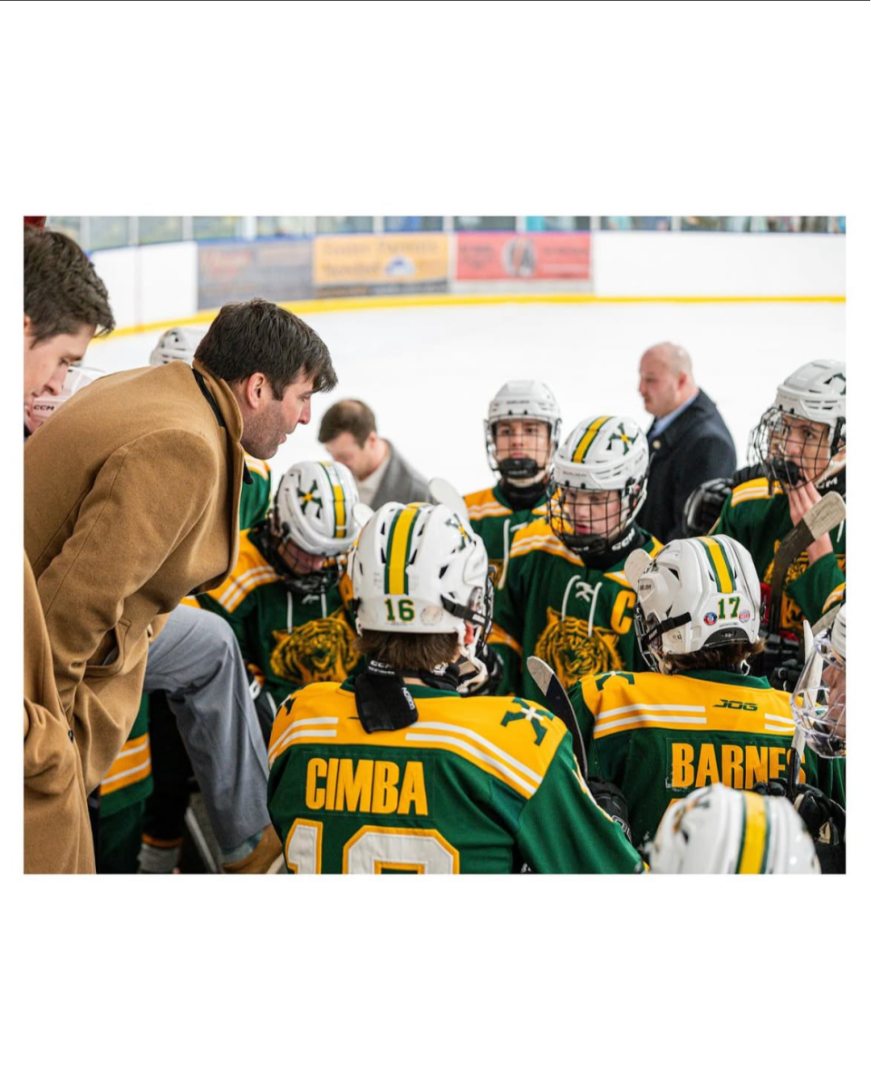 Coach Frank giving pre-game pep talk