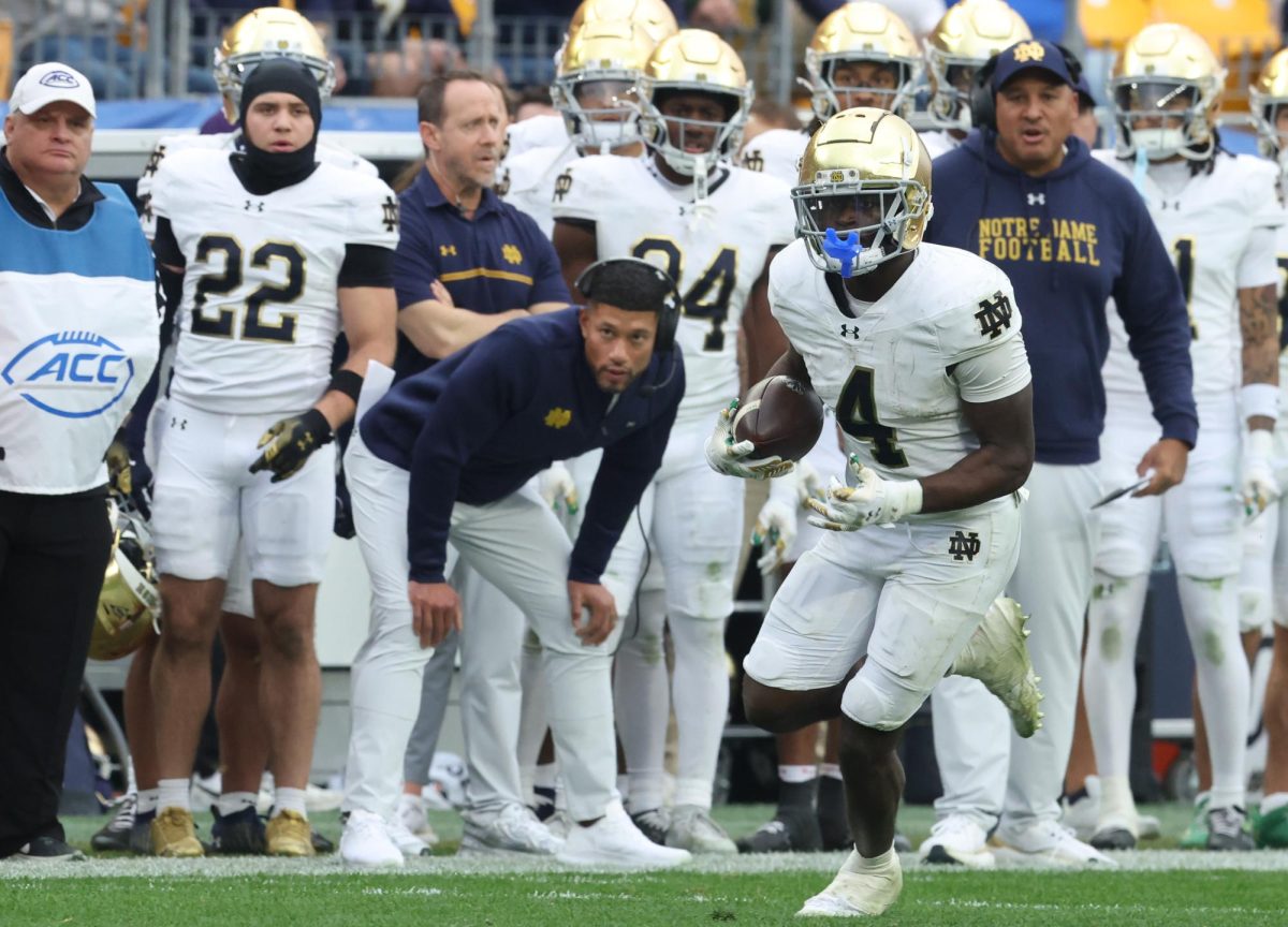 Nov 15, 2025; Pittsburgh, Pennsylvania, USA;  Notre Dame Fighting Irish running back Jeremiyah Love (4) runs the ball against the Pittsburgh Panthers during the fourth quarter at Acrisure Stadium. Mandatory Credit: Charles LeClaire-Imagn Images