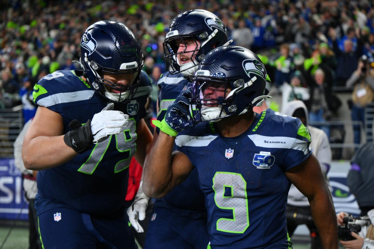 Jan 17, 2026; Seattle, WA, USA; Seattle Seahawks running back Kenneth Walker III (9) reacts with teammates after scoring a touchdown against the San Francisco 49ers during the second half in an NFC Divisional Round game at Lumen Field. Mandatory Credit: Steven Bisig-Imagn Images