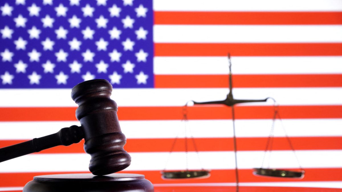 The U.S. flag, a judge gavel and a vintage scale are seen in this illustration taken August 6, 2024. REUTERS/Dado Ruvic/Illustration