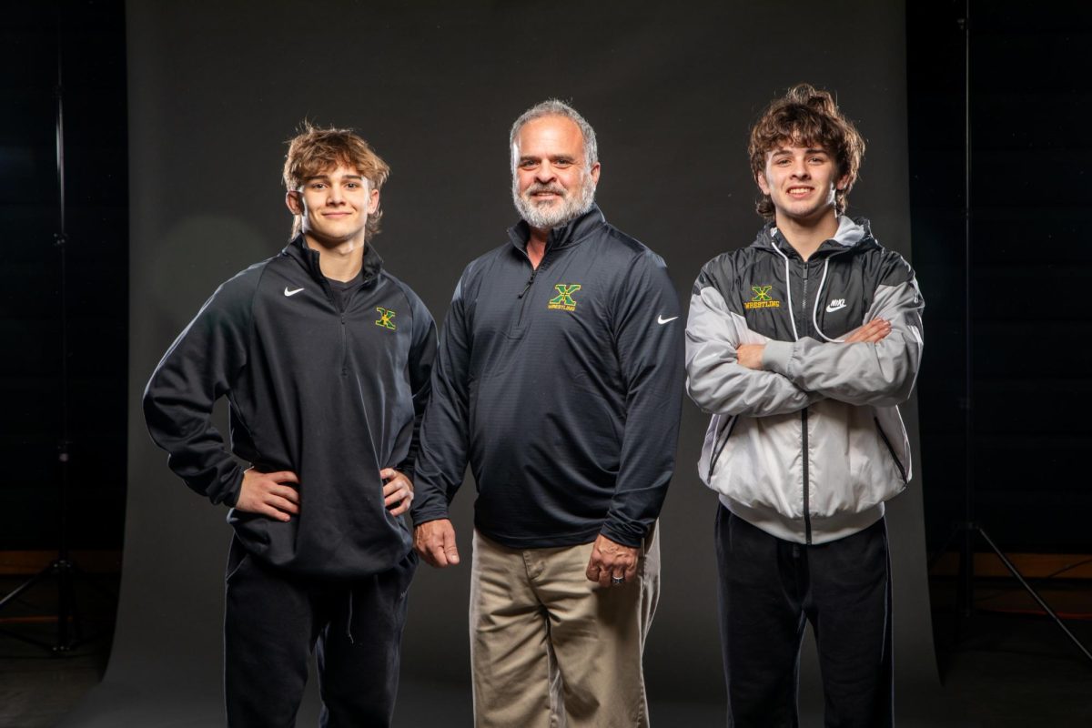 Nate Bueter on the left, Coach Bueter in the middle, and Henry Bueter on the right 