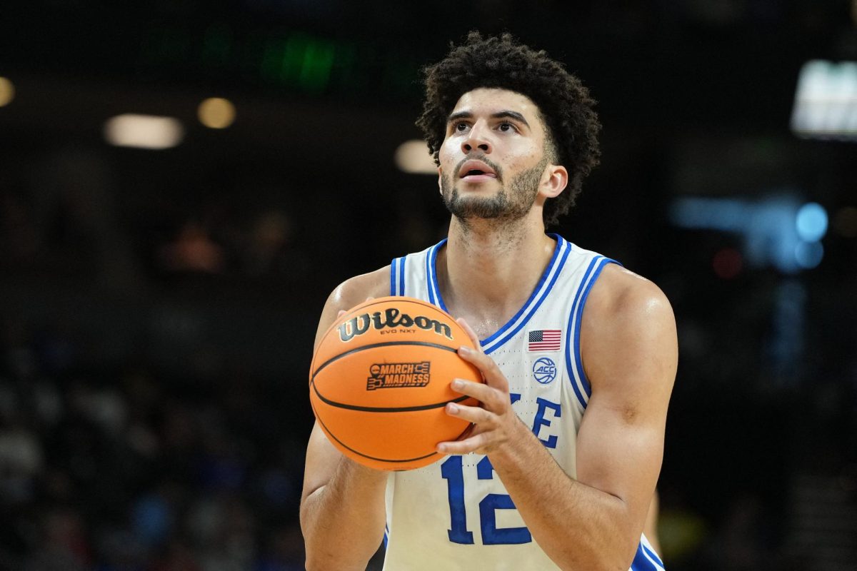 Mar 19, 2026; Greenville, SC, USA; Duke Blue Devils forward Cameron Boozer (12) shoots a free throw against the Siena Saints in the first half during a first round game of the men's 2026 NCAA Tournament at Bon Secours Wellness Arena. Mandatory Credit: Bob Donnan-Imagn Images