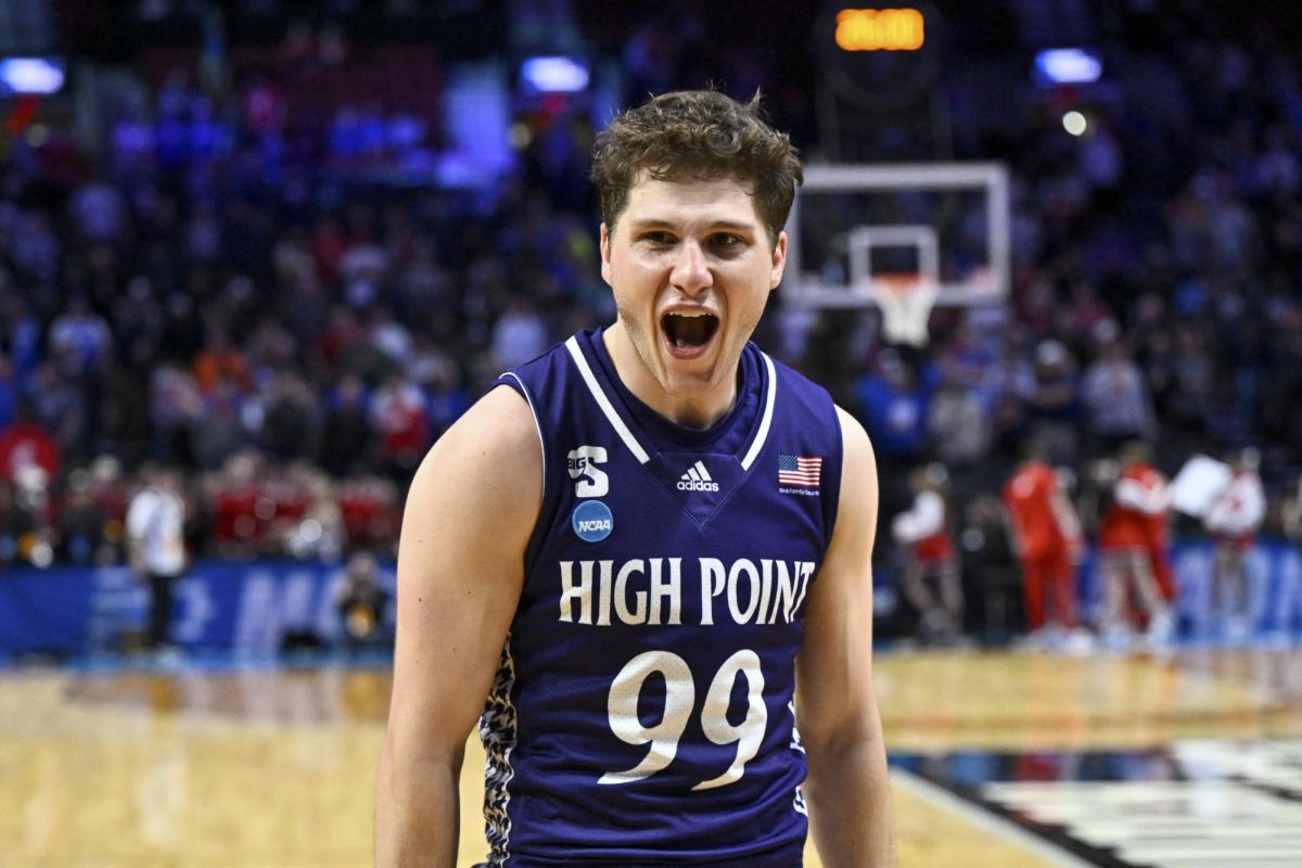 Mar 19, 2026; Portland, OR, USA; High Point Panthers guard Chase Johnston (99) reacts after defeating the Wisconsin Badgers in a first round game of the men's 2026 NCAA Tournament at Moda Center. Mandatory Credit: Craig Strobeck-Imagn Images