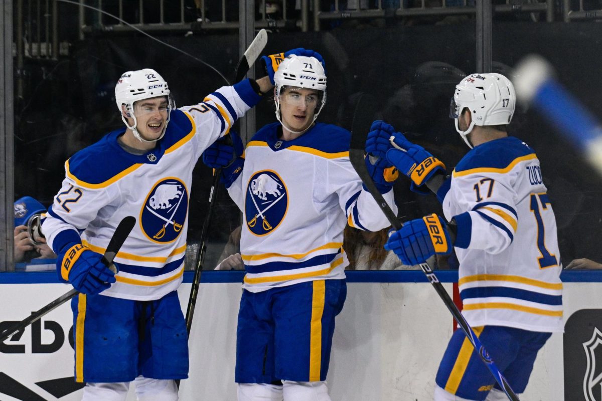 Apr 8, 2026; New York, New York, USA; Buffalo Sabres left wing Jason Zucker (17) and right wing Jack Quinn (22) celebrates the goal by center Ryan McLeod (71) against the New York Rangers during the first period at Madison Square Garden. Mandatory Credit: Dennis Schneidler-Imagn Images